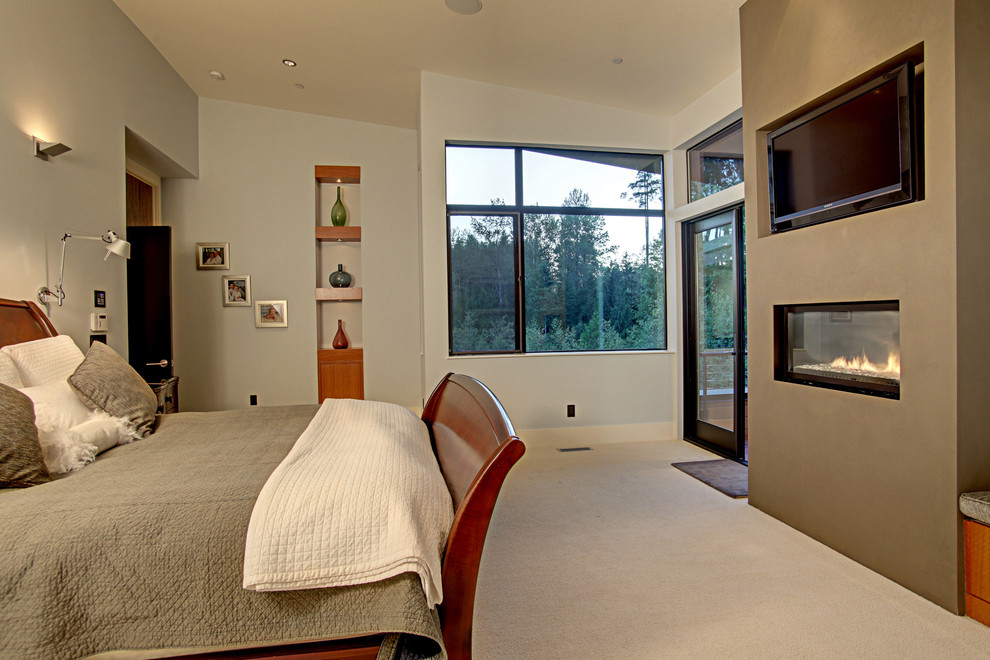 Contemporary bedroom in Seattle with grey walls, carpet and a ribbon fireplace.