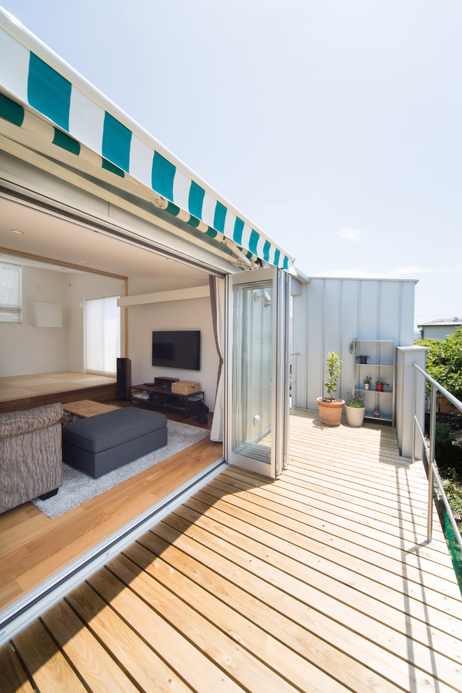 Inspiration for a small coastal balcony deck remodel