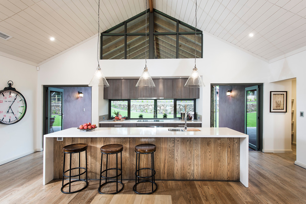 Design ideas for a mid-sized contemporary galley eat-in kitchen in Perth with with island, an undermount sink, flat-panel cabinets, dark wood cabinets, quartzite benchtops, glass sheet splashback, stainless steel appliances and vinyl floors.