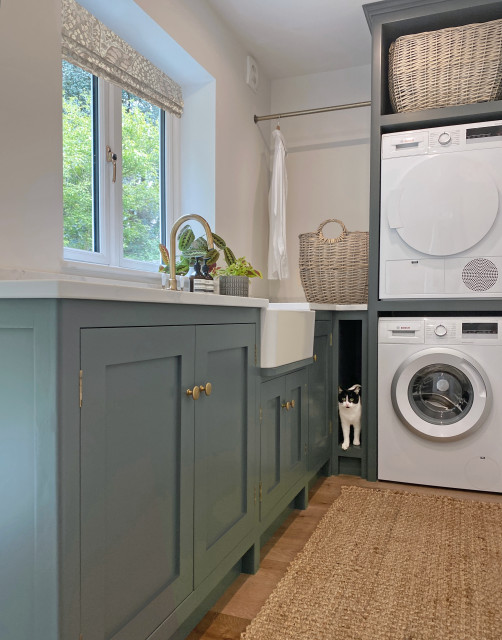 A practical utility with a hidden cat flap - Laundry Room - Other - by ...