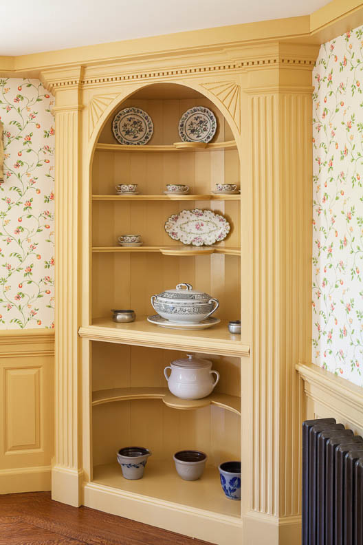 Dining room - cottage medium tone wood floor dining room idea in Boston with multicolored walls