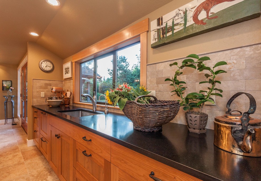 Large transitional porcelain tile and beige floor open concept kitchen photo in Seattle with an undermount sink, shaker cabinets, medium tone wood cabinets, solid surface countertops, beige backsplash, stone tile backsplash, stainless steel appliances and an island
