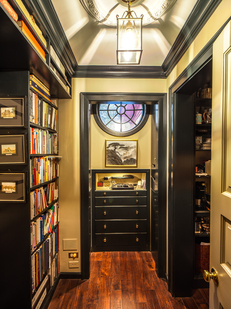 Photo of a traditional storage and wardrobe in Chicago with open cabinets and black cabinets.