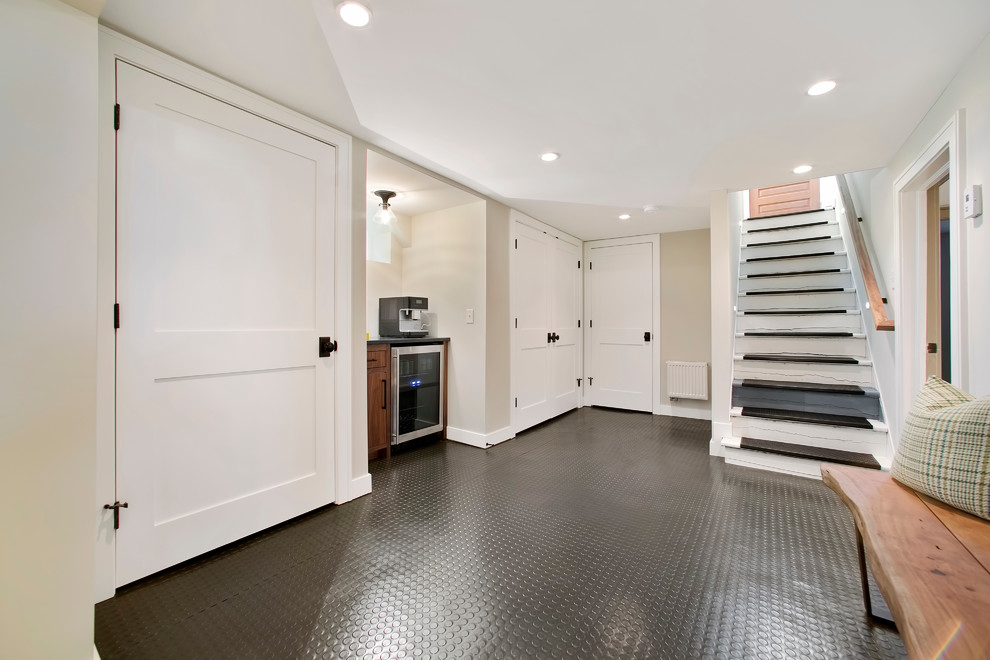 Photo of a transitional basement in Minneapolis with grey floor.