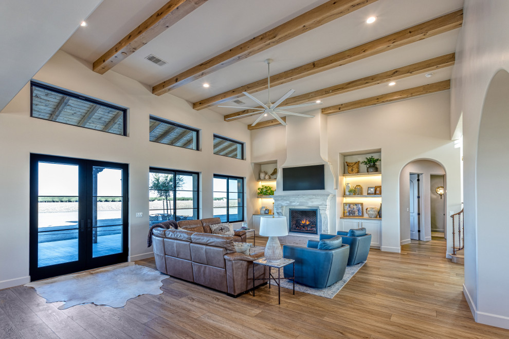 Great Room Fireplace with Expansive Window Wall | Tuscan Farmhouse