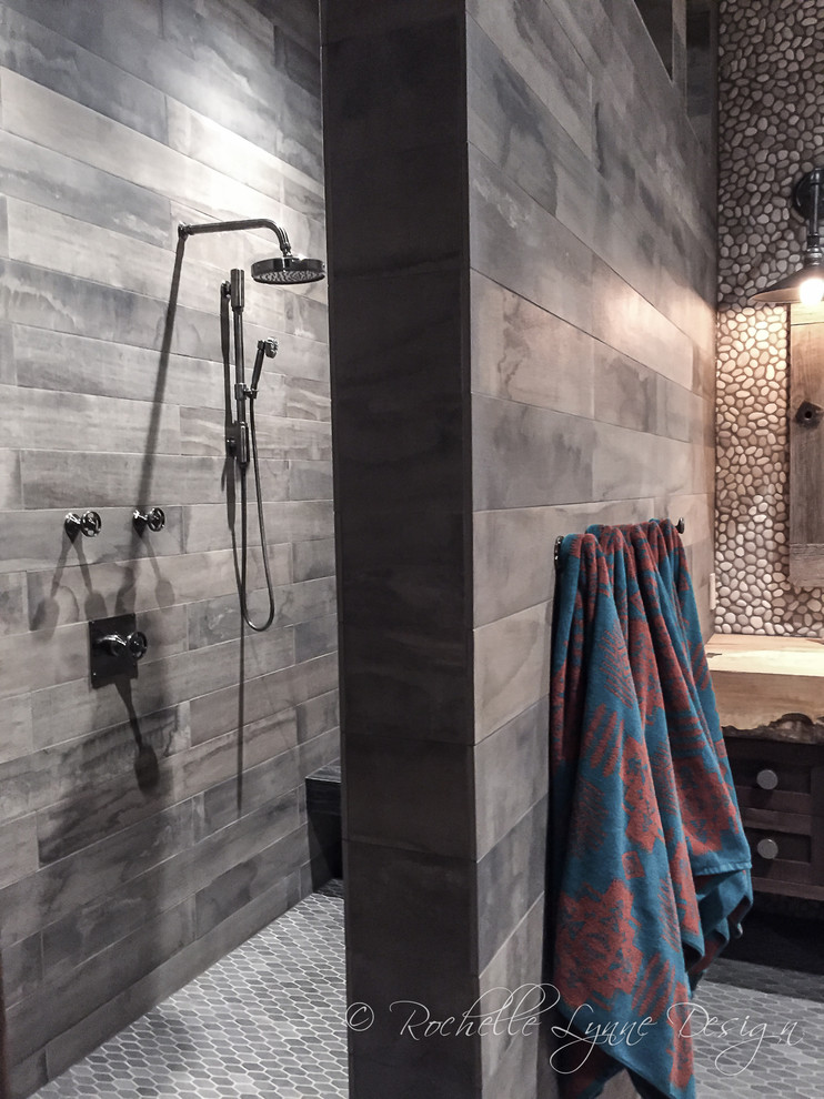 Huge mountain style kids' multicolored tile and pebble tile mosaic tile floor doorless shower photo in Calgary with distressed cabinets, wood countertops and shaker cabinets