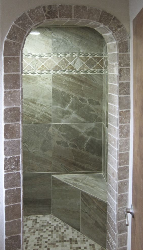 Design ideas for a mid-sized mediterranean bathroom in Houston with an alcove shower, multi-coloured tile and stone tile.