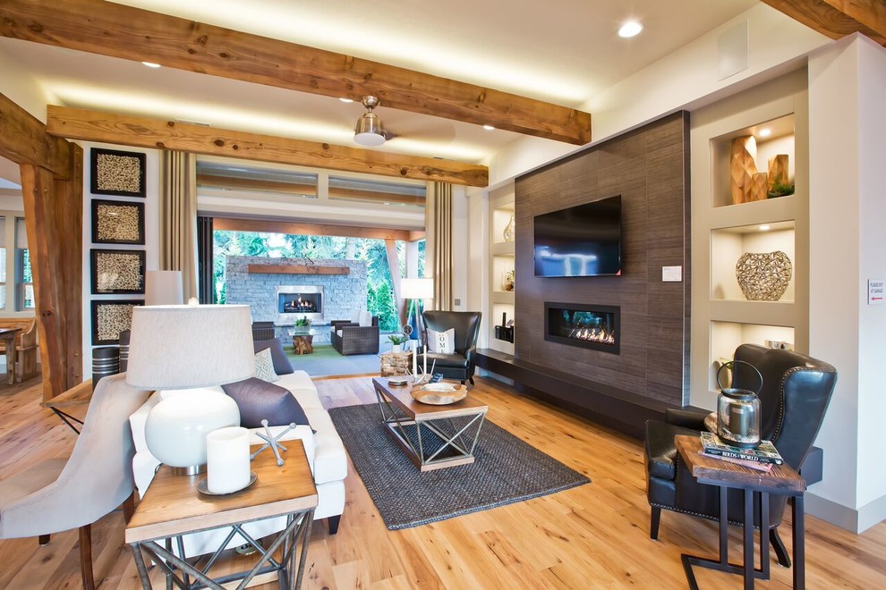 This is an example of a country open concept living room in Portland with white walls, a ribbon fireplace and a wall-mounted tv.