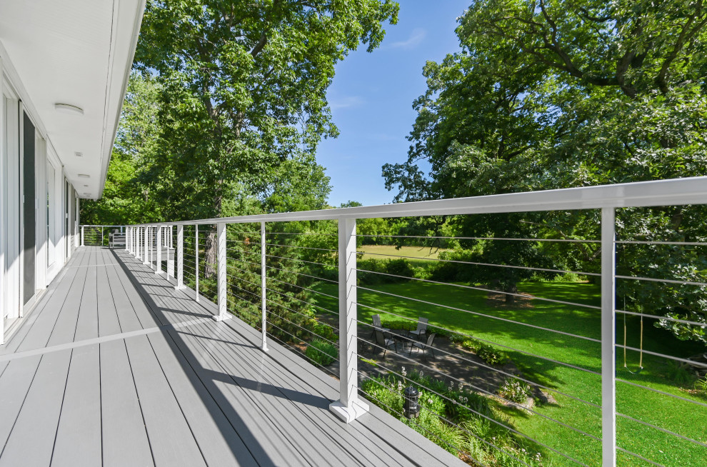 Design ideas for a backyard deck in Chicago with cable railing.