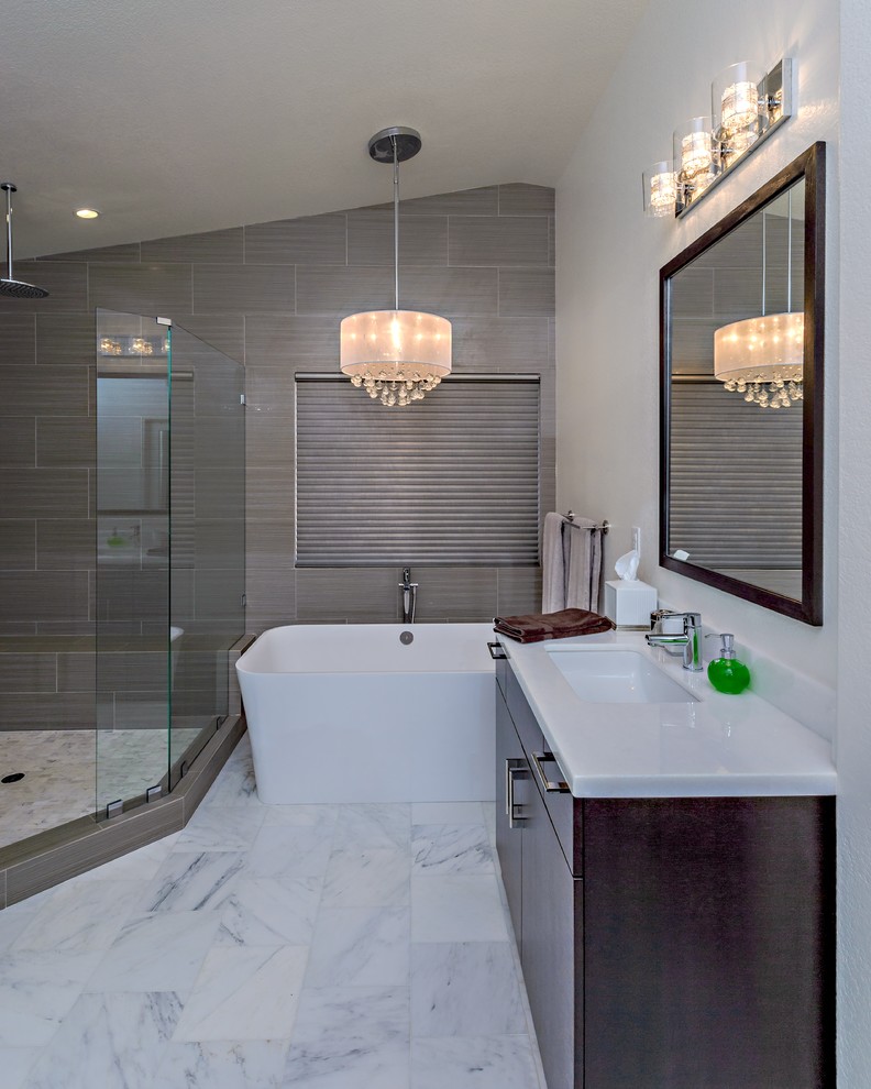 Inspiration for a mid-sized contemporary master bathroom in San Diego with flat-panel cabinets, dark wood cabinets, quartzite benchtops, a freestanding tub, a corner shower, brown tile, ceramic tile, beige walls, marble floors and an undermount sink.