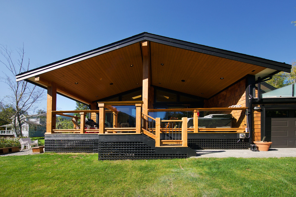 Mid-sized rustic brown two-story wood exterior home idea in Vancouver with a clipped gable roof