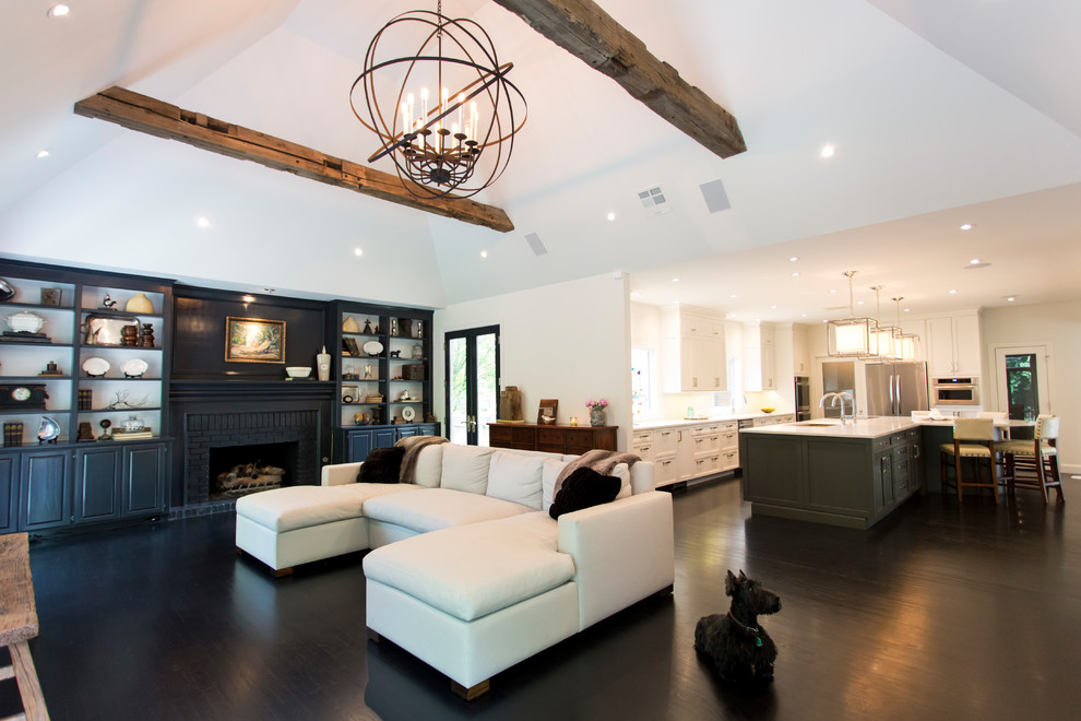 Kitchen - large transitional l-shaped dark wood floor and brown floor kitchen idea with an undermount sink, shaker cabinets, white cabinets, quartz countertops, white backsplash, stainless steel appliances, an island and white countertops
