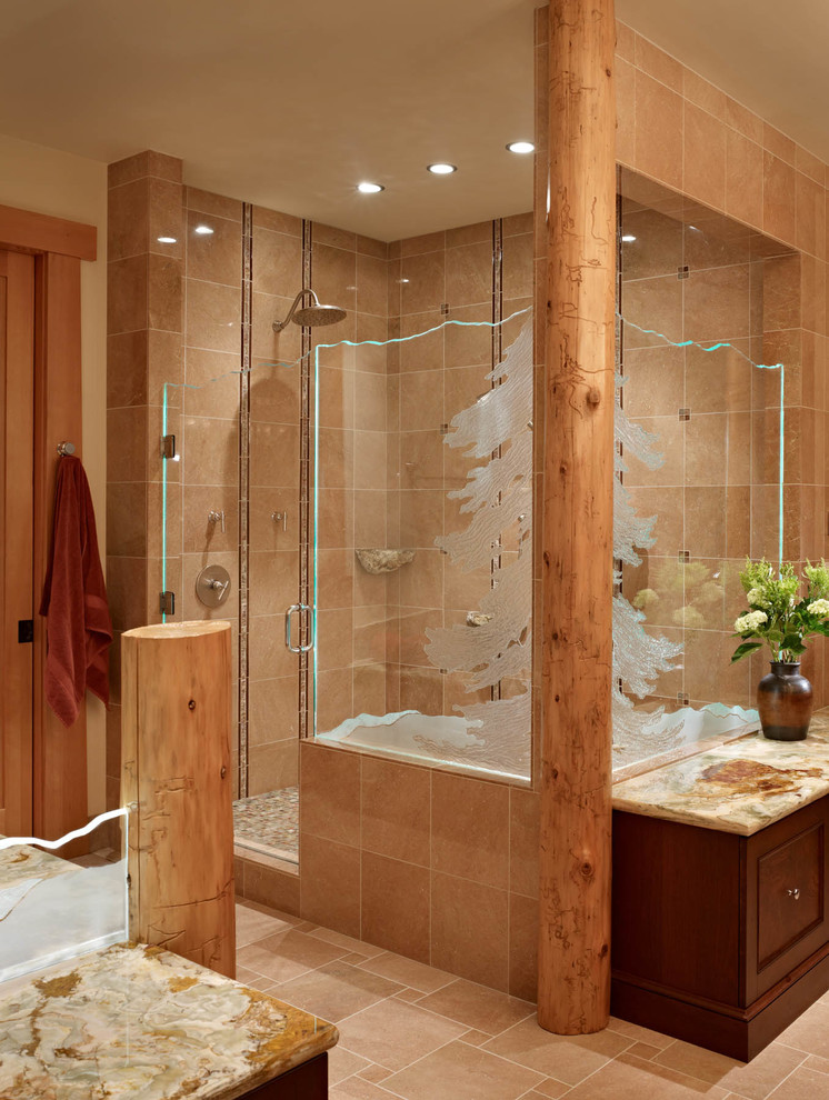 Inspiration for a country master bathroom in Seattle with dark wood cabinets, a corner shower, ceramic tile, ceramic floors, quartzite benchtops, brown tile, a hinged shower door and recessed-panel cabinets.