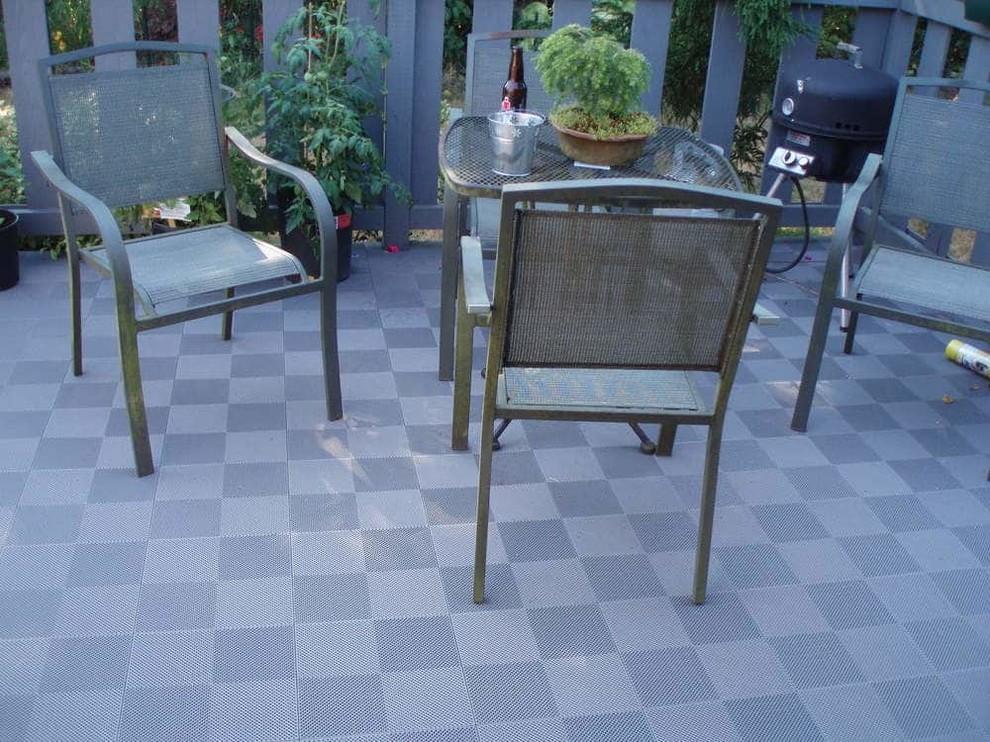 Inspiration for a mid-sized traditional patio in Houston with tile.