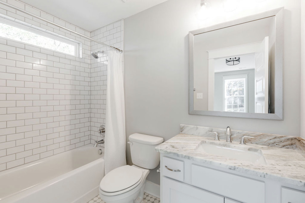 Bathroom - mid-sized traditional kids' white tile ceramic tile, white floor and single-sink bathroom idea in Richmond with recessed-panel cabinets, white cabinets, a two-piece toilet, gray walls, an undermount sink, solid surface countertops, white countertops and a built-in vanity