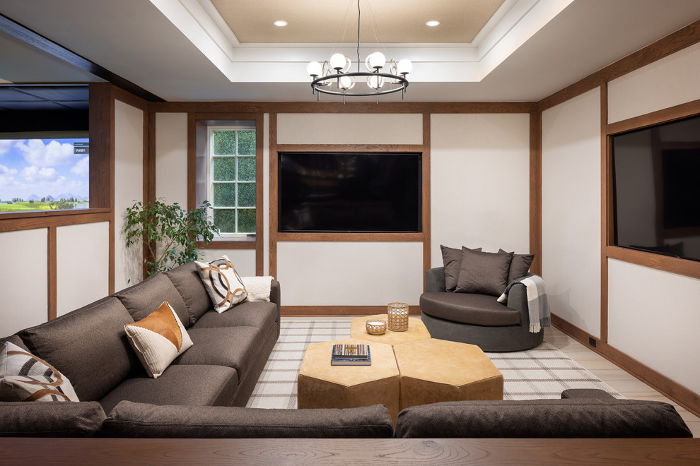 Photo of a mid-sized transitional enclosed home theatre in New York with medium hardwood floors and a wall-mounted tv.