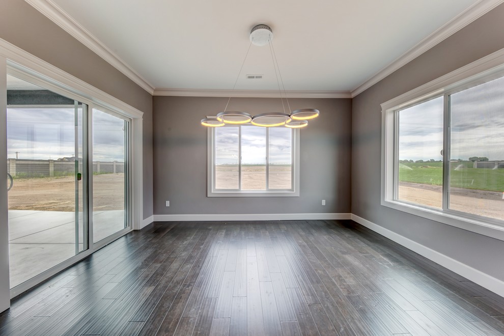 Inspiration for a mid-sized transitional medium tone wood floor great room remodel in Seattle with gray walls