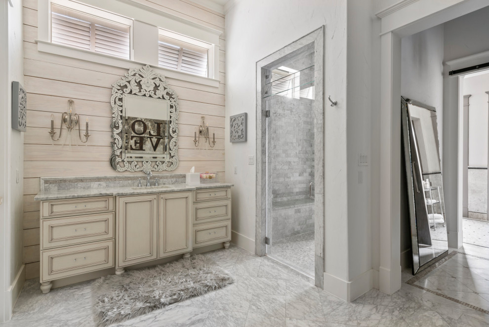 Design ideas for a bathroom in Houston with recessed-panel cabinets, beige cabinets, an alcove shower, gray tile, white walls, an undermount sink, grey floor, a hinged shower door, grey benchtops, a shower seat, a single vanity, a built-in vanity and planked wall panelling.