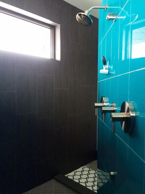 Inspiration for a large transitional master blue tile and porcelain tile porcelain tile home design remodel with recessed-panel cabinets, dark wood cabinets, a two-piece toilet, gray walls, an undermount sink and granite countertops