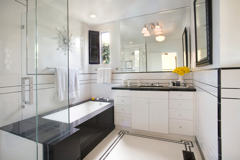 Design ideas for a large transitional master bathroom in Los Angeles with an undermount sink, shaker cabinets, white cabinets, soapstone benchtops, a drop-in tub, a corner shower, white tile, subway tile, white walls and mosaic tile floors.