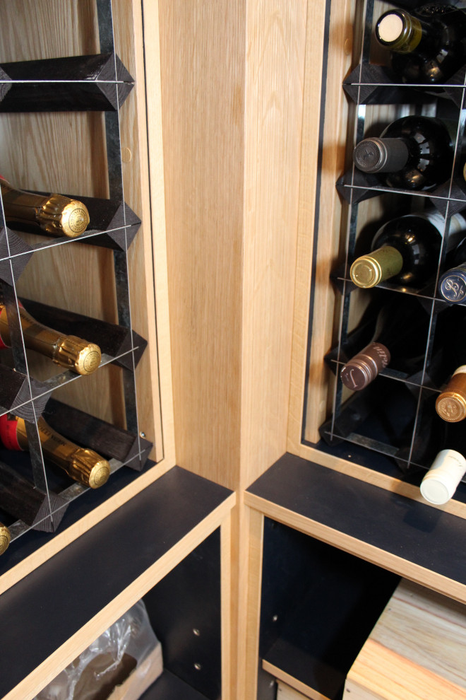 Small contemporary wine cellar in Oxfordshire with vinyl floors and storage racks.