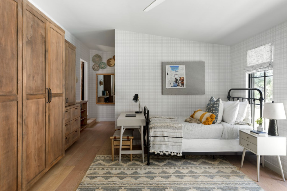 Photo of a medium sized farmhouse kids' bedroom in Los Angeles with white walls and medium hardwood flooring.