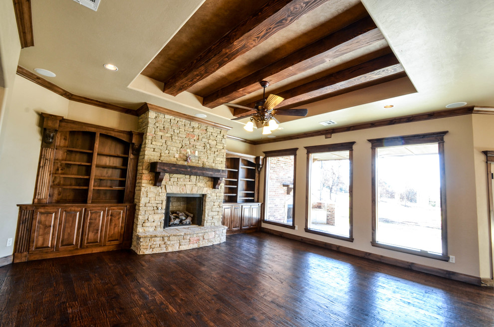 Design ideas for a large contemporary formal open concept living room in Oklahoma City with beige walls, dark hardwood floors, a two-sided fireplace, a stone fireplace surround and a built-in media wall.
