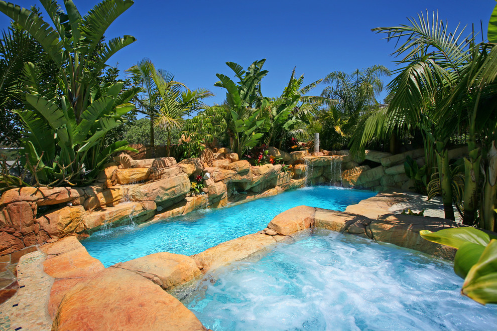Inspiration for a tropical custom-shaped natural pool in Orange County.