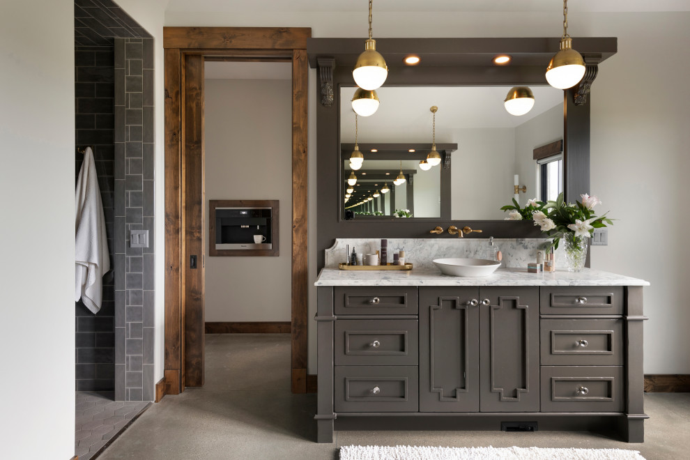 This is an example of a country bathroom in Minneapolis with recessed-panel cabinets, grey cabinets, a curbless shower, gray tile, white walls, concrete floors, a vessel sink, grey floor, an open shower, white benchtops, a single vanity and a freestanding vanity.