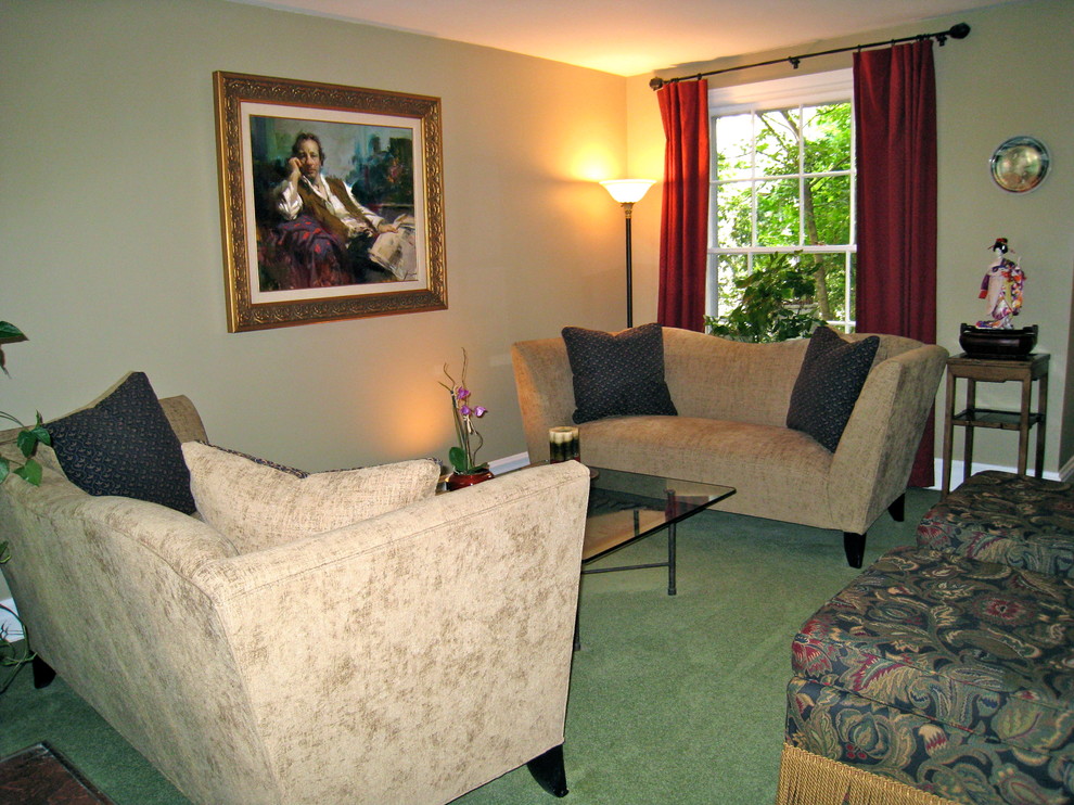 This is an example of a small traditional open concept living room in Chicago with beige walls and carpet.