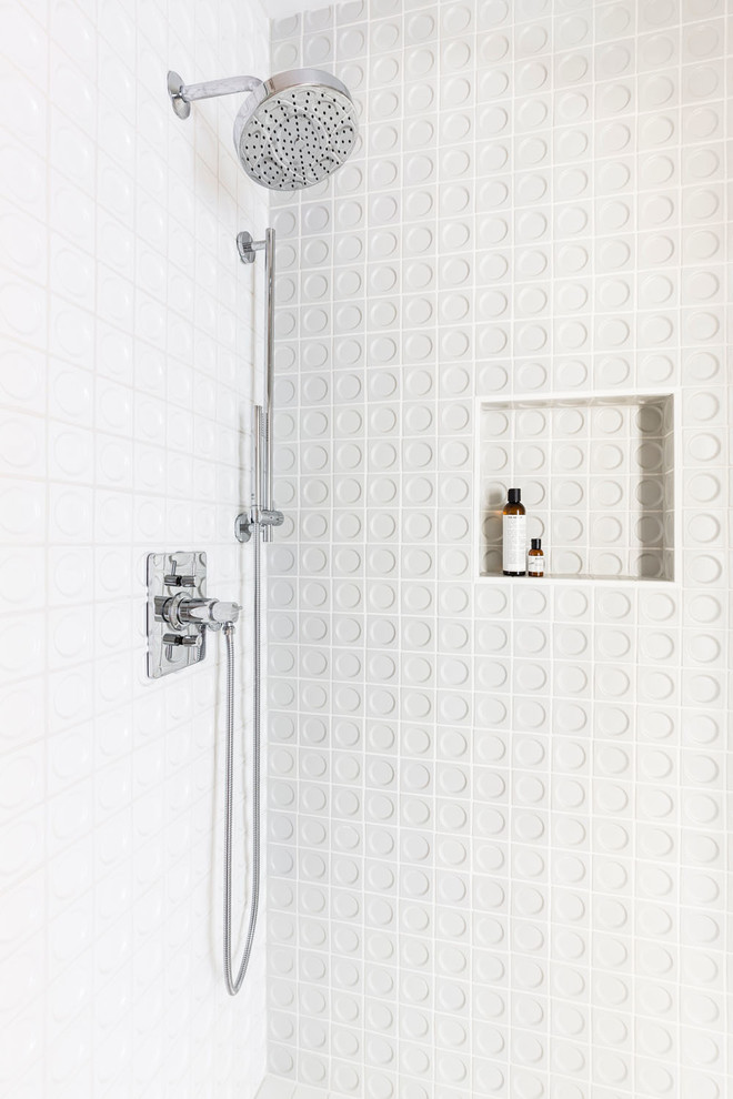 Inspiration for a midcentury bathroom in Portland with an alcove shower, white tile, porcelain tile and a hinged shower door.