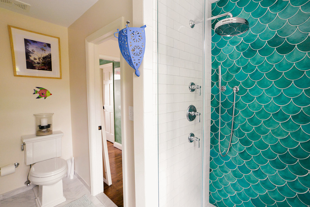 Inspiration for a mid-sized mediterranean master bathroom in Baltimore with an alcove shower, a two-piece toilet, green tile, ceramic tile, beige walls, marble floors and white cabinets.