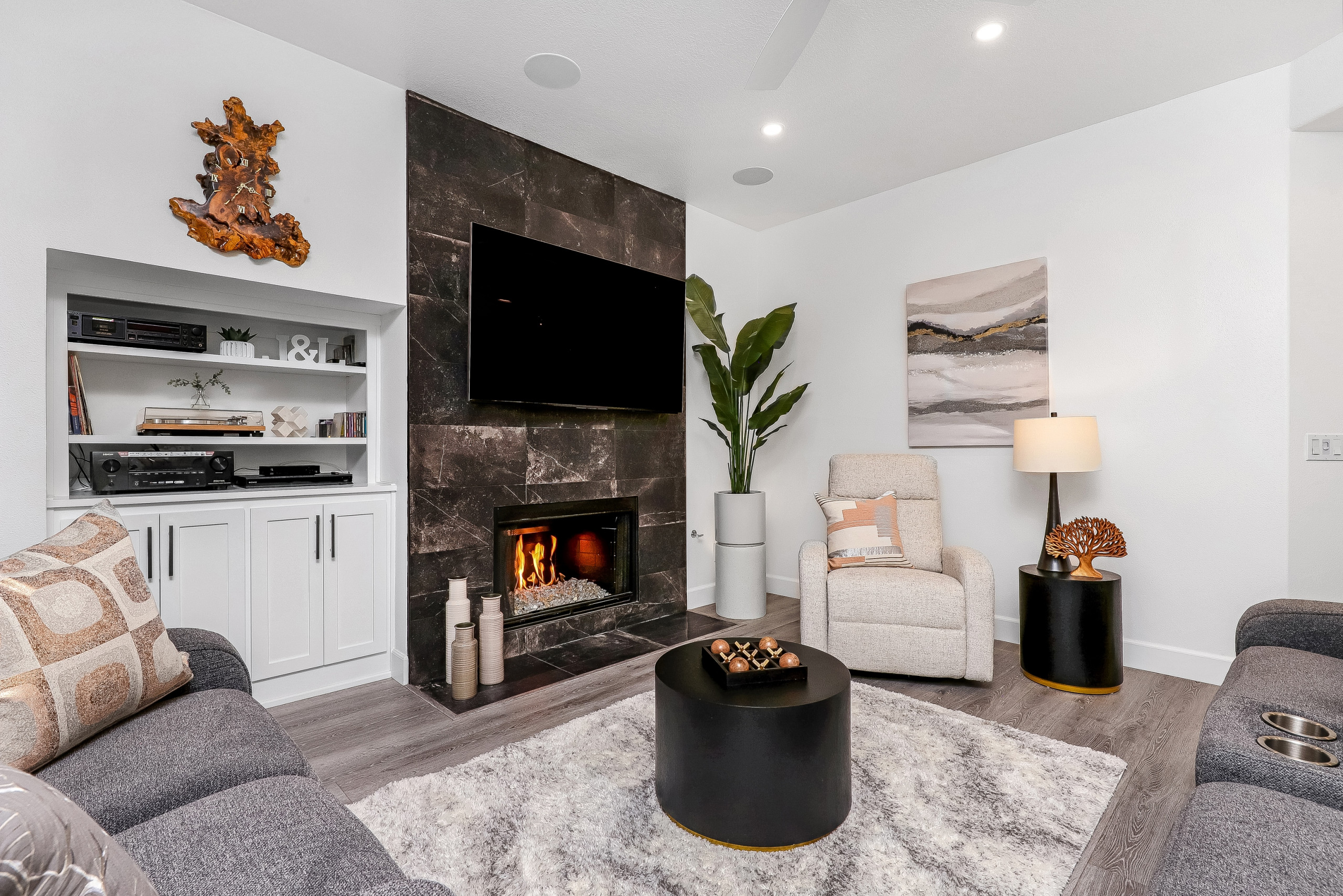 Floor to Celling Black Tiled Fireplace with Contemporary White Shaker Built-in E