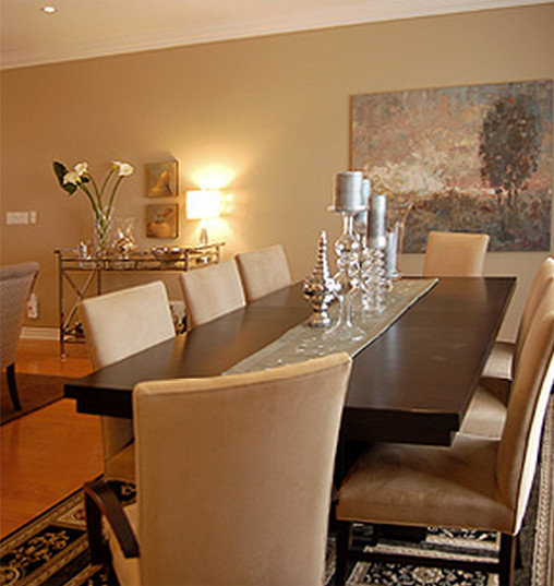 Photo of a large contemporary dining room in Toronto with brown walls and light hardwood floors.
