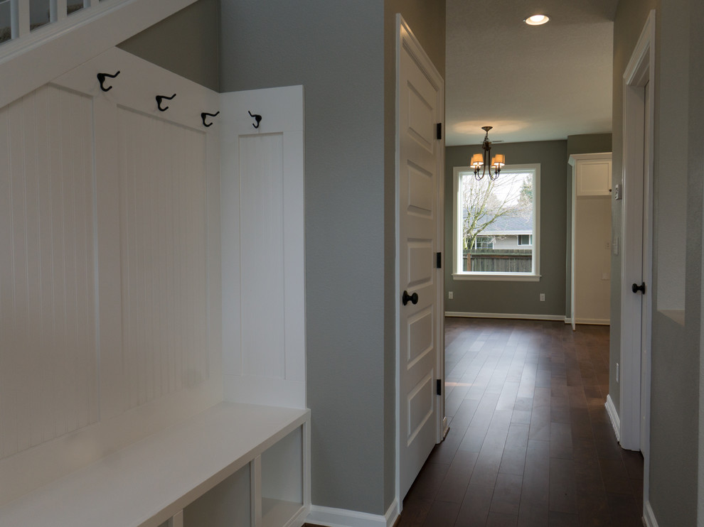 Photo of a small traditional front door in Portland with beige walls, medium hardwood floors, a single front door and a medium wood front door.