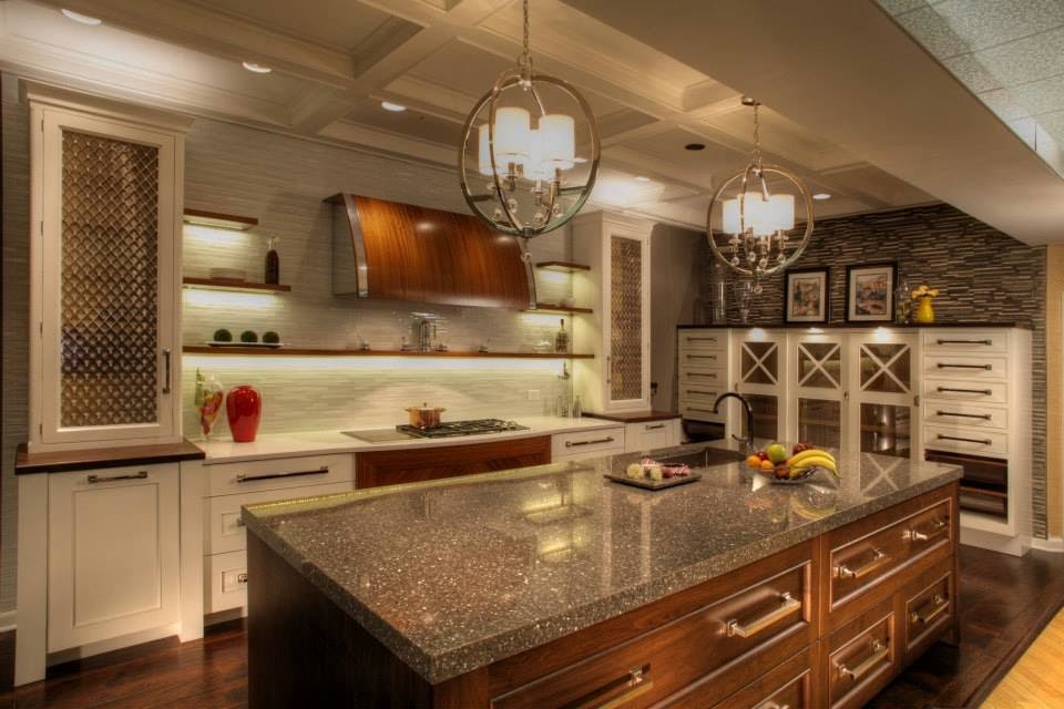 Example of a transitional kitchen design in Miami with an island