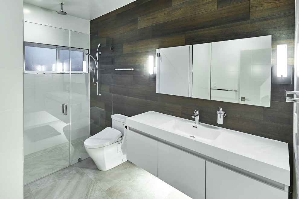 Photo of a large contemporary 3/4 bathroom in San Francisco with flat-panel cabinets, white cabinets, a curbless shower, white tile, porcelain tile, white walls, porcelain floors, an undermount sink, engineered quartz benchtops, grey floor, a hinged shower door and white benchtops.