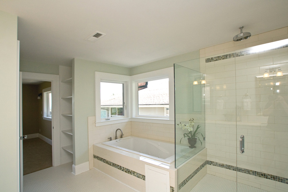Photo of a large traditional master bathroom in Portland with an undermount sink, recessed-panel cabinets, white cabinets, marble benchtops, a drop-in tub, an alcove shower, white tile, porcelain tile, beige walls and porcelain floors.