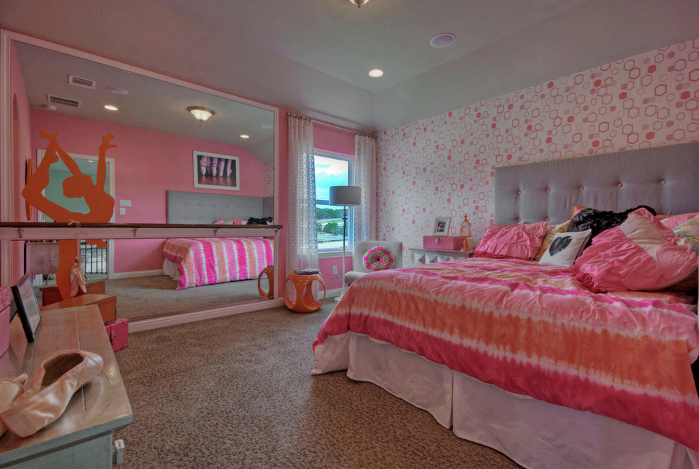 Inspiration for a mid-sized transitional kids' room for girls in Austin with pink walls and carpet.