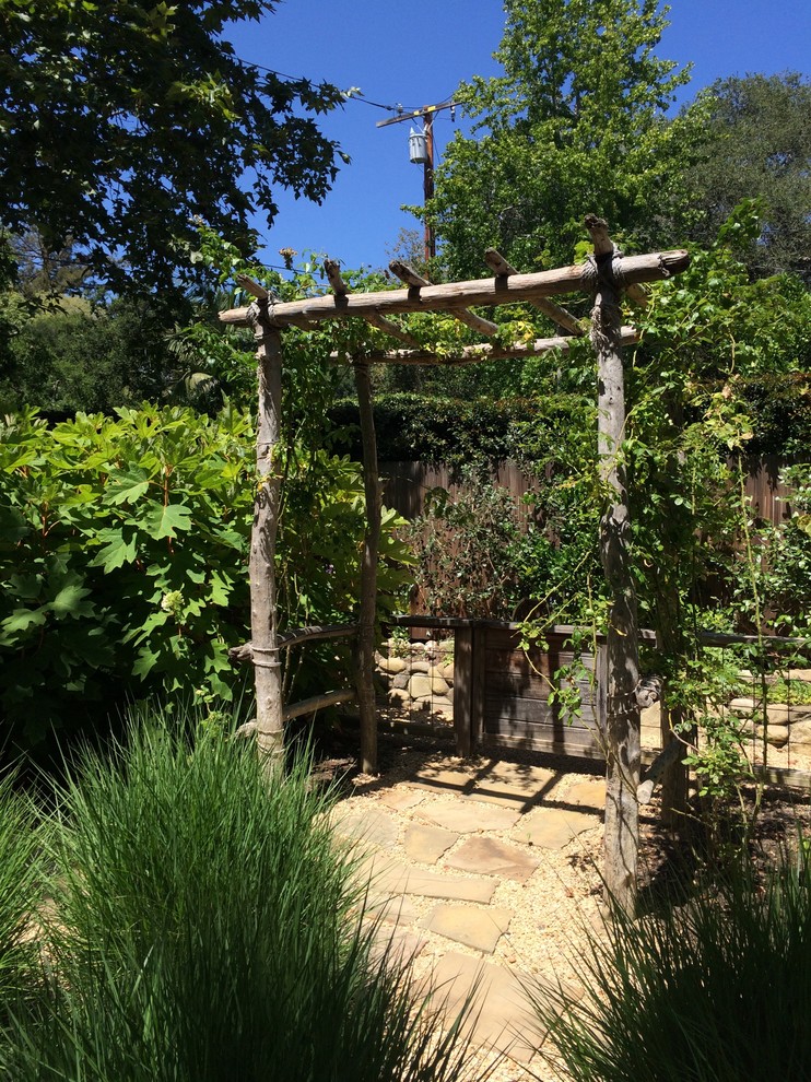 Photo of a mid-sized mediterranean shaded outdoor sport court for summer in Santa Barbara with a vegetable garden and decking.