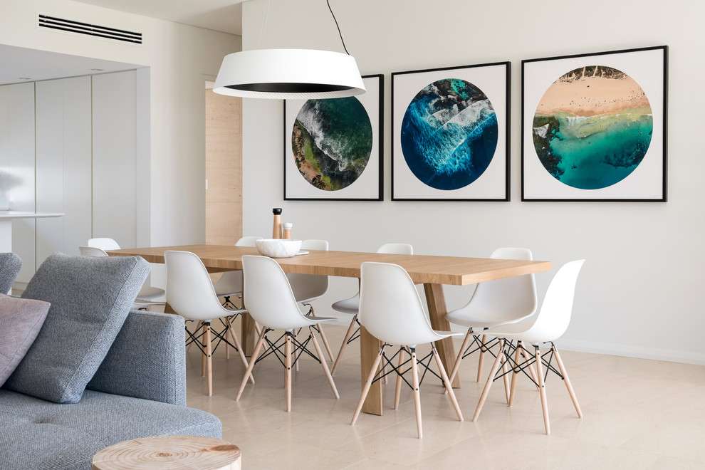 Photo of a modern dining room in Perth with white walls and beige floor.