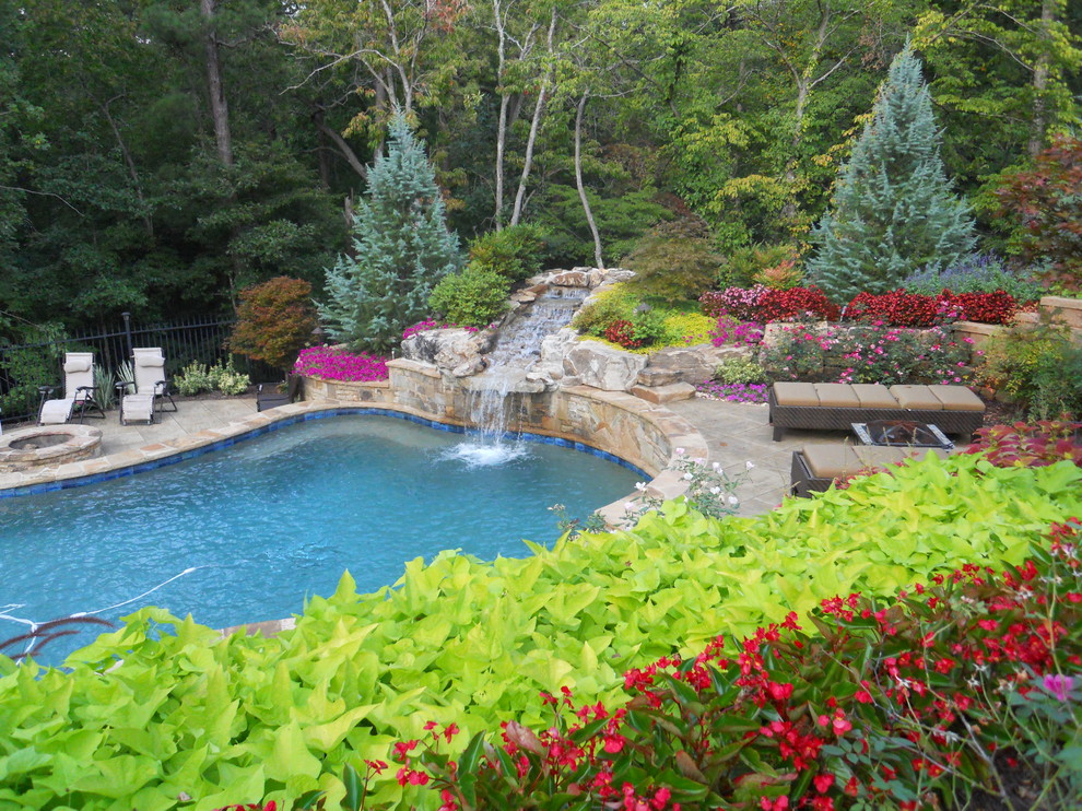 Design ideas for a traditional custom-shaped pool in Atlanta with a water feature.