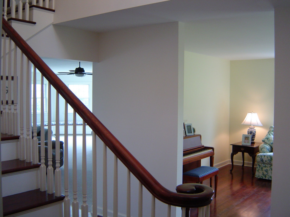Inspiration for a mid-sized wooden l-shaped wood railing staircase remodel with wooden risers