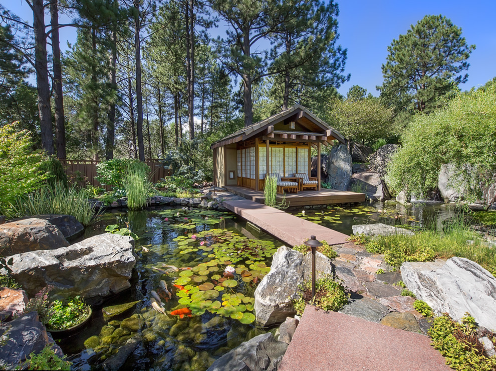 This is an example of an asian garden in Denver with a water feature.