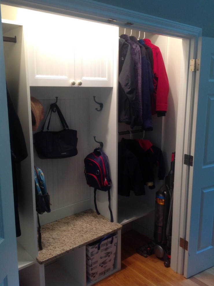 This is an example of a transitional storage and wardrobe in Boston.