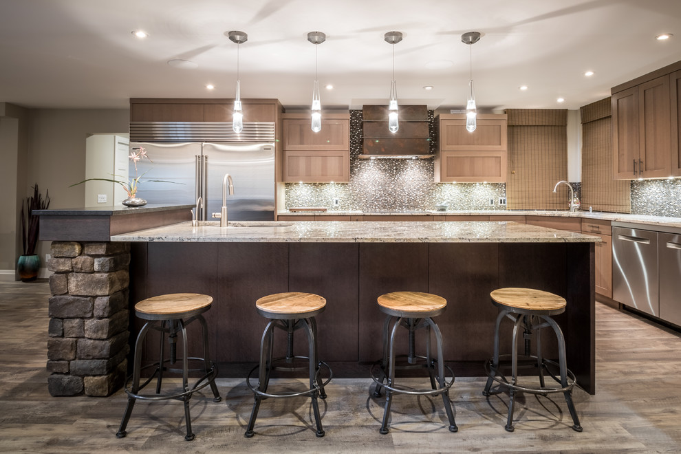 Transitional l-shaped vinyl floor and gray floor eat-in kitchen photo with an undermount sink, shaker cabinets, light wood cabinets, granite countertops, brown backsplash, mosaic tile backsplash, stainless steel appliances and an island