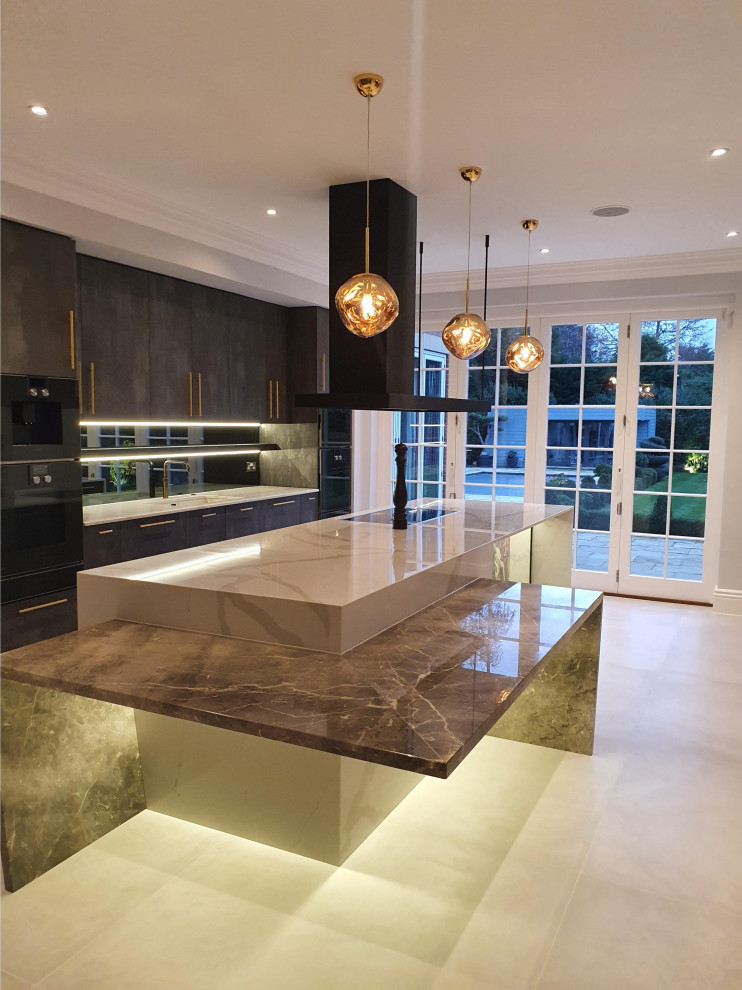 This is an example of a large contemporary single-wall kitchen/diner in London with a built-in sink, flat-panel cabinets, grey cabinets, composite countertops, grey splashback, mirror splashback, black appliances, ceramic flooring, an island, white floors, multicoloured worktops and feature lighting.