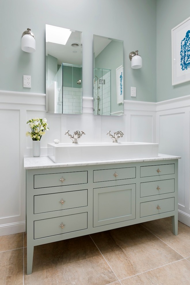 This is an example of a mid-sized traditional master bathroom in Auckland with a trough sink, green cabinets, marble benchtops, white tile, ceramic tile, green walls, porcelain floors and shaker cabinets.