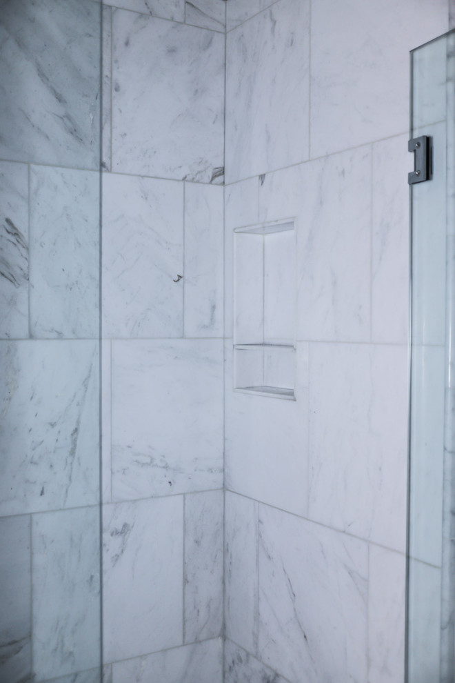 Example of a mid-sized transitional master white tile and marble tile ceramic tile and gray floor alcove bathtub design with gray walls, beaded inset cabinets, white cabinets, a two-piece toilet, an undermount sink, quartzite countertops and a hinged shower door