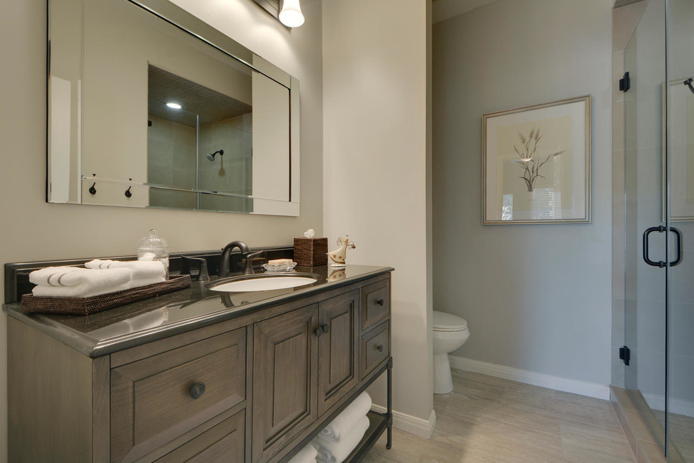 Large transitional 3/4 gray tile and mosaic tile porcelain tile alcove bathtub photo in Austin with shaker cabinets, white cabinets, a one-piece toilet, gray walls, quartzite countertops and an undermount sink